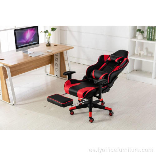 Silla roja para juegos de computadora con reposapiés y respaldo de almohada